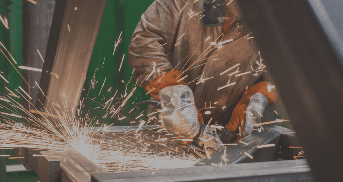 Metalworker-working-with-angle-grinder_4328x2304