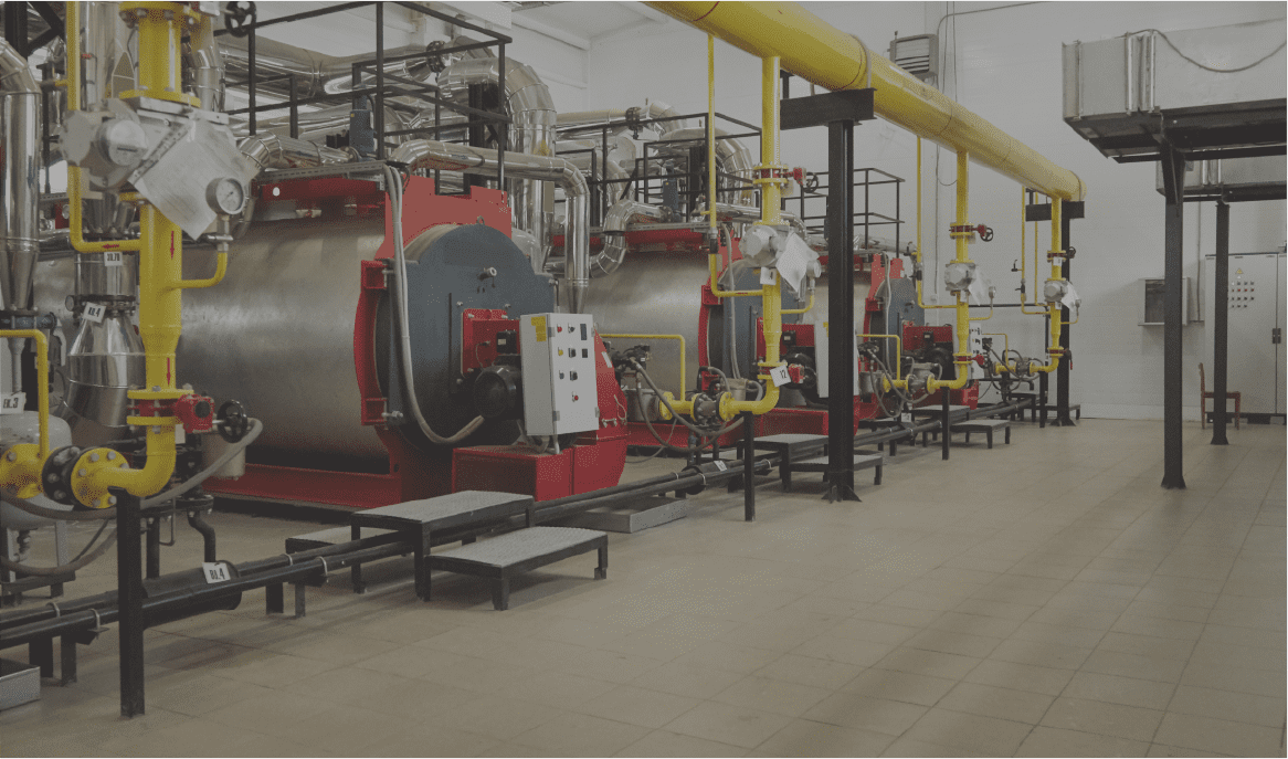 Modern new gas heating coppers work in a boiler room.